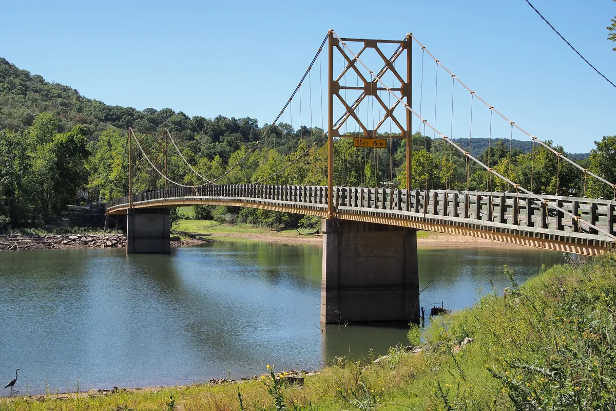 Yellow suspension towers of Beaver Bridge over the White River arm of Table Rock Lake in Beaver, Arkansas